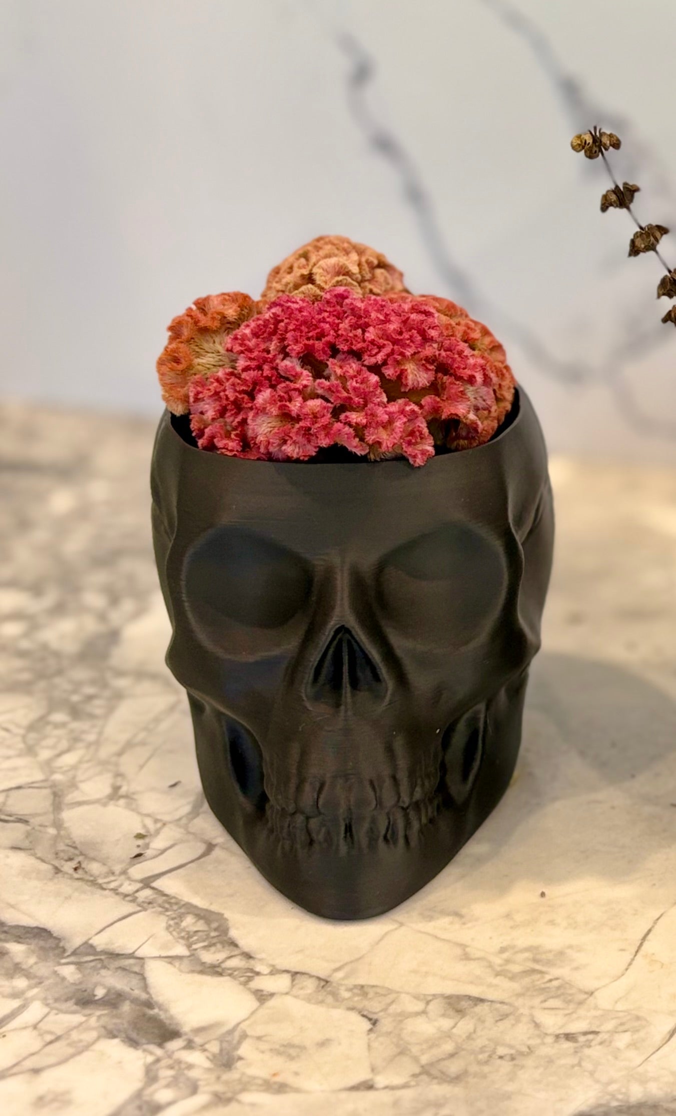 Skull Vase With Dried Flowers