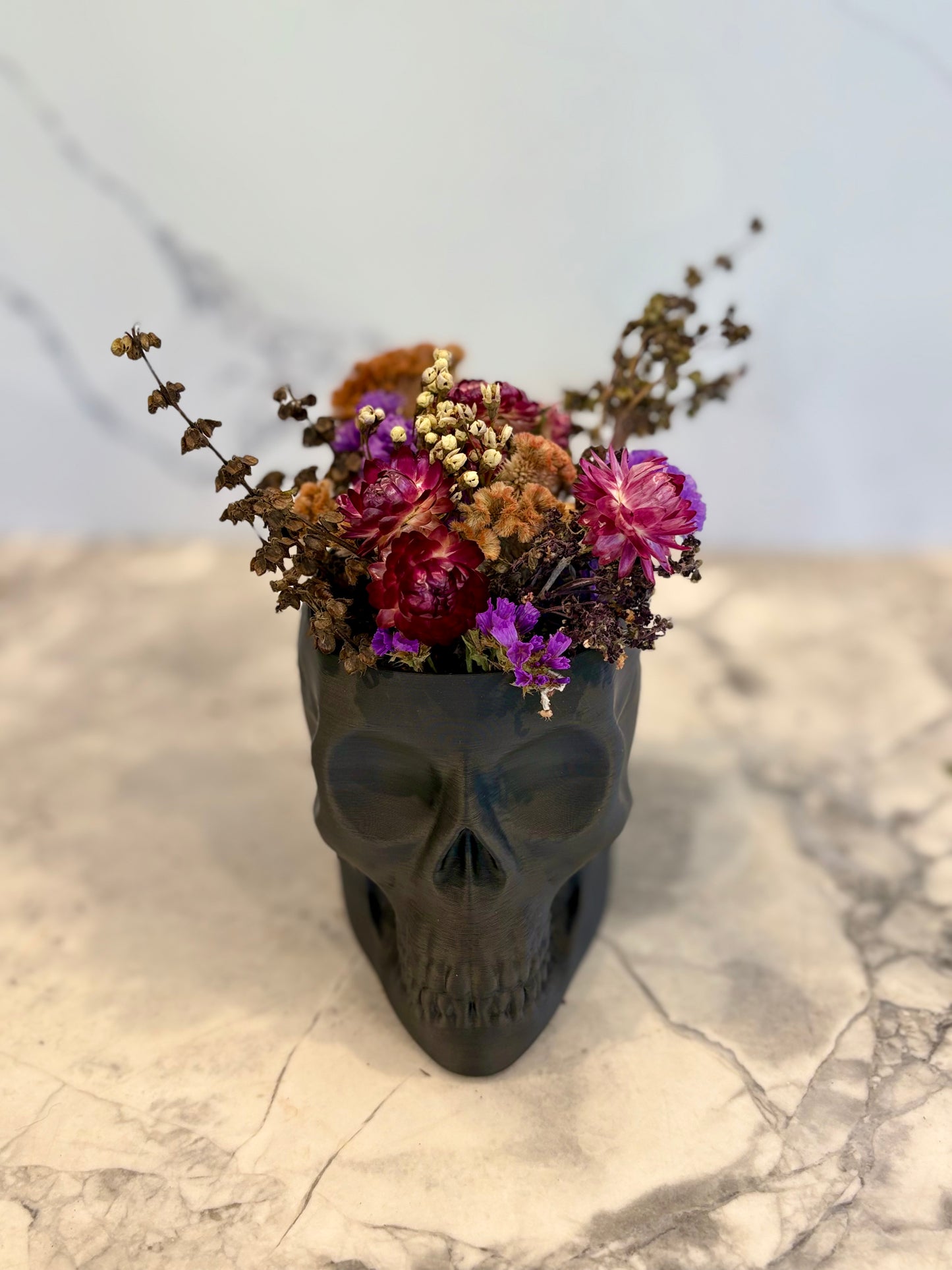Skull Vase With Dried Flowers